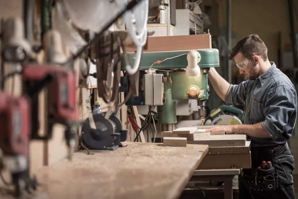 Picture of skilled carpenter using new technology at work