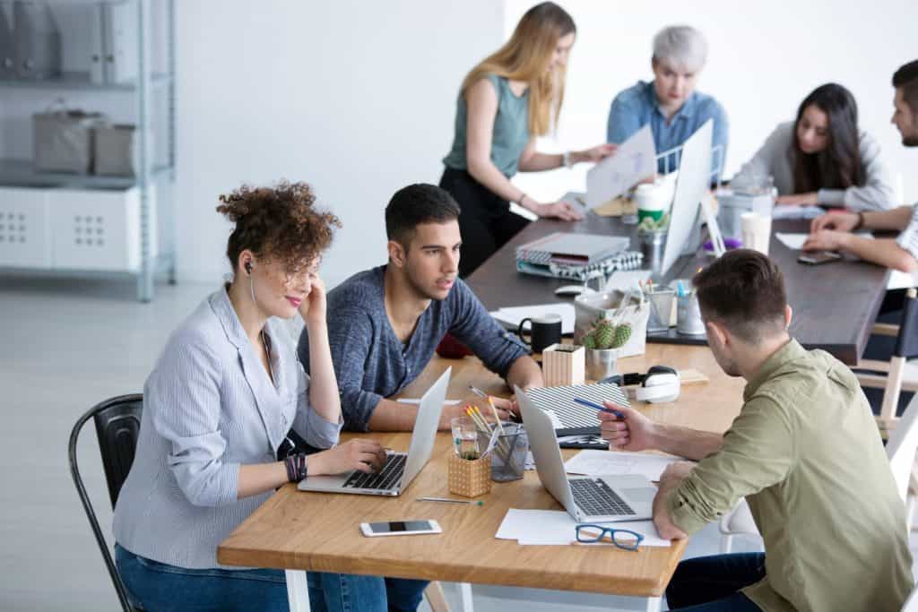 High angle of multicultural team working together in the corporation office