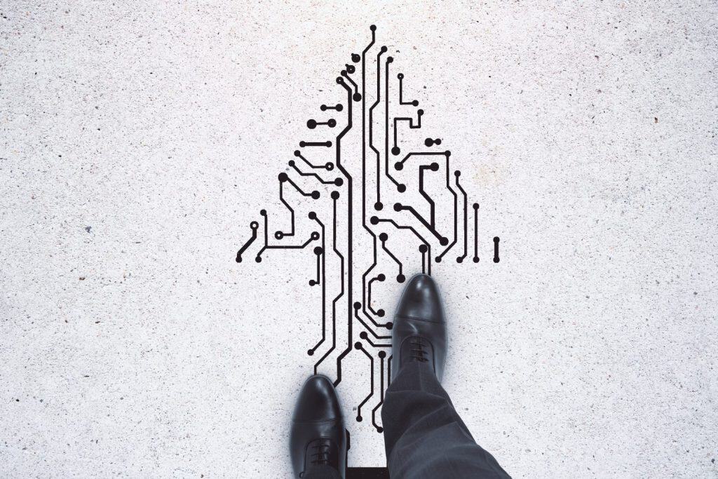 Top view of businessman feet standing on abstract circuit arrow sketch on white ground background with mock up place. Success and digital transformation concept