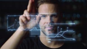 Futuristic ceo work process man analysing holographic graphs calculating benefit. Thoughtful employee examining financial data checking statistics closeup. Digital modern high-tech business concept