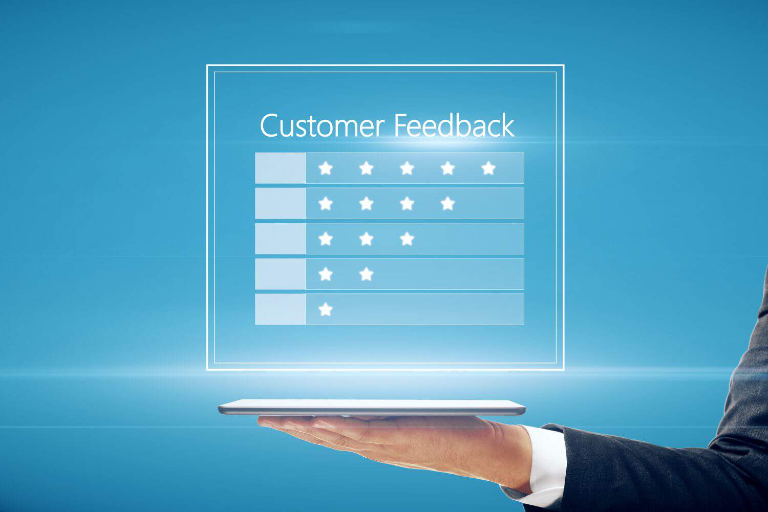 Close up of businessman hand holding tablet with customer feedback hologram on blue background. Rating and ranking concept