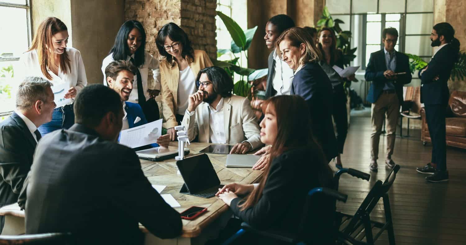 Multiracial business people working on sustainable innovation project - Green renewable energy concept - Soft focus on right senior woman face